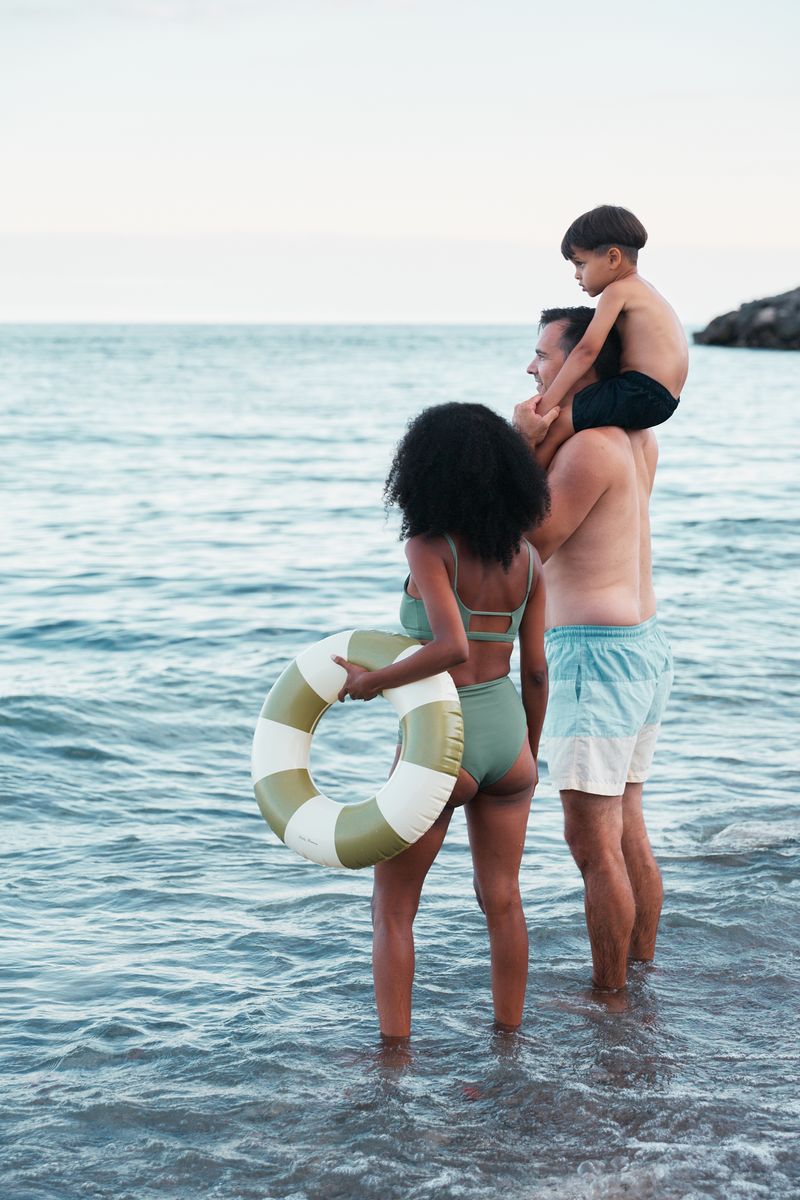 A family enjoying the Lake Ontario shoreline